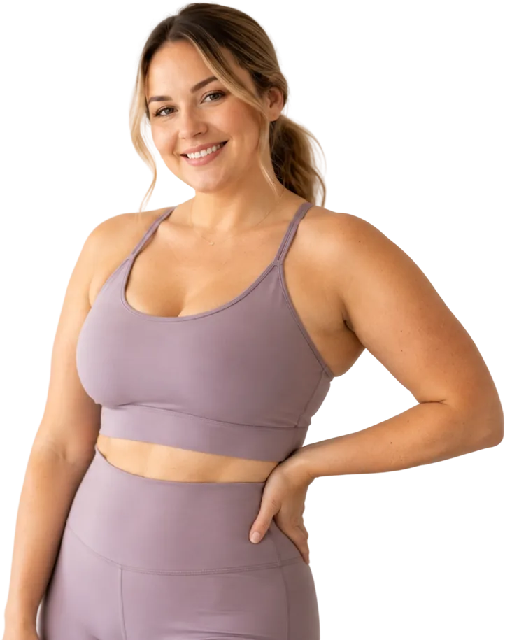 Smiling woman celebrating her weight-loss results